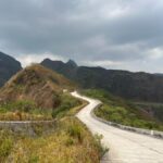 Surabaya Mount Kelud Full-Day Private Trekking Tour - Walking uphill toward Kelud’s crater rim