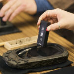 Tokyo: Shinjuku Calligraphy Workshop & Scroll - From traditional workwear to ink and brush