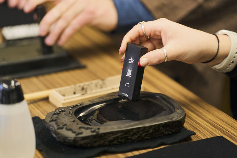 Tokyo: Shinjuku Calligraphy Workshop & Scroll - From traditional workwear to ink and brush