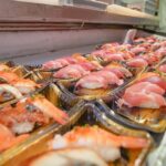 Tsukiji Fish Market Tour: Behind the Scenes & 10 Seafood Tastings - Follow the guide into Tsukiji Outer Market