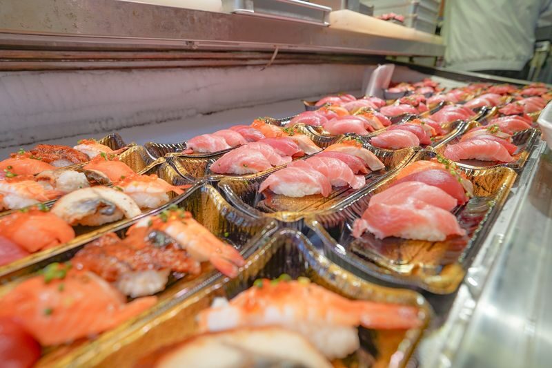 Tsukiji Fish Market Tour: Behind the Scenes & 10 Seafood Tastings - Follow the guide into Tsukiji Outer Market
