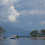 Vientiane Nam Ngum Reservoir Full-Day Big Group Tour - Vang Xang’s cliff-carved Buddhas