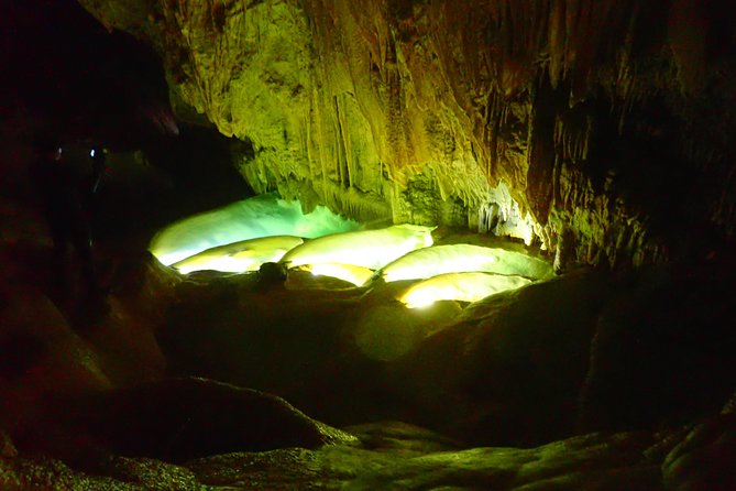 Okinawa Miyako Is a Place in Japan Known for Its Beautiful Beaches and Scenic Landscapes. "Ryugu Miyagi" Refers to the Exploration of Mysterious Underwater Caves in the Area. the Term "Pumpkin Limestone Caving" Likely Refers to the Unique Rock Formations Found Within These Caves. - The Charm of Japans Okinawa Miyako