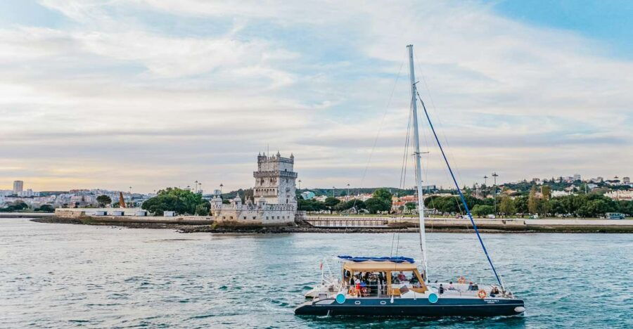 Lisbon: Sunset Catamaran- Music, a Drink & Christmas Lights - Good To Know